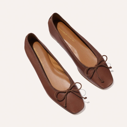 The Fonteyn - Cognac Nappa brown leather ballet flats featuring a chic squared-off toe and a small bow at the front.