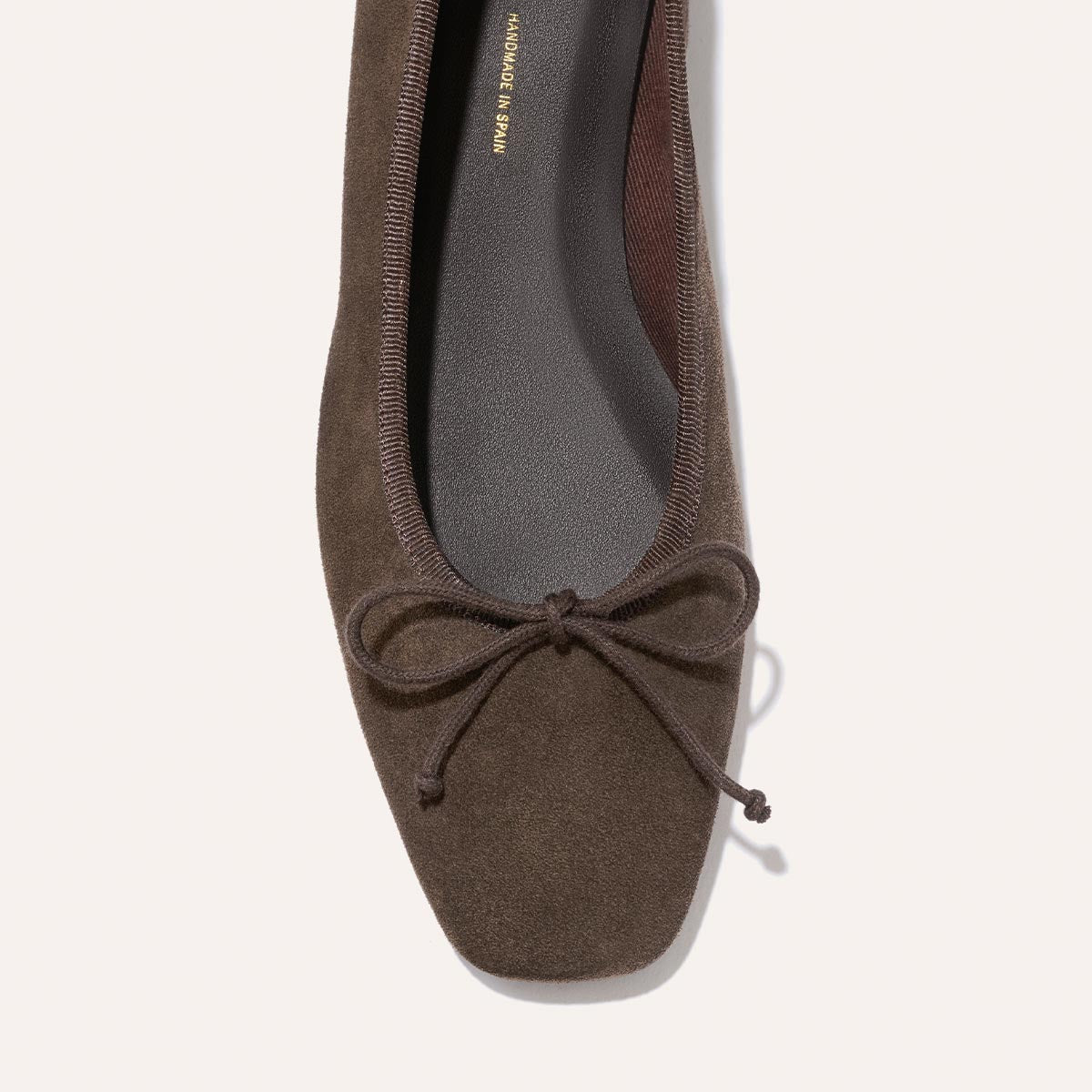 The Fonteyn - English Brown Suede ballet flat features a chic square toe and a small bow on the front for a comfort-first fit.