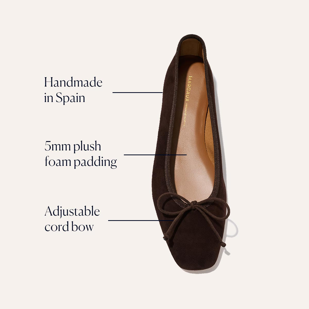 Margaux's The Fonteyn - Espresso Suede, a brown ballet flat handcrafted in Spain, is shown from above with labels noting its 5mm plush foam comfort padding and adjustable cord bow.