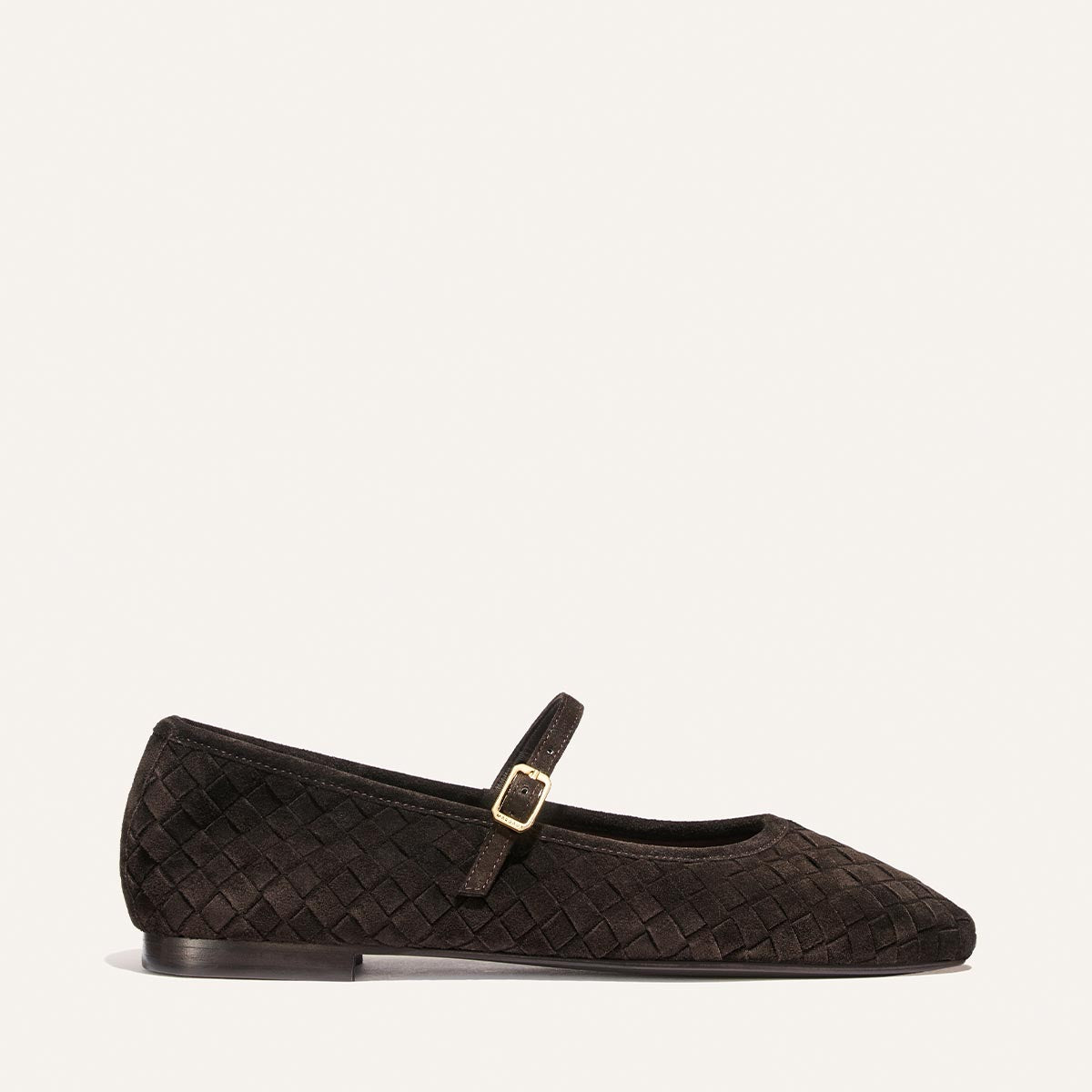 The Margaux Fonteyn Jane in dark chocolate woven Pasado suede, a Mary Jane flat featuring a small gold buckle, is shown in profile against a plain white background.
