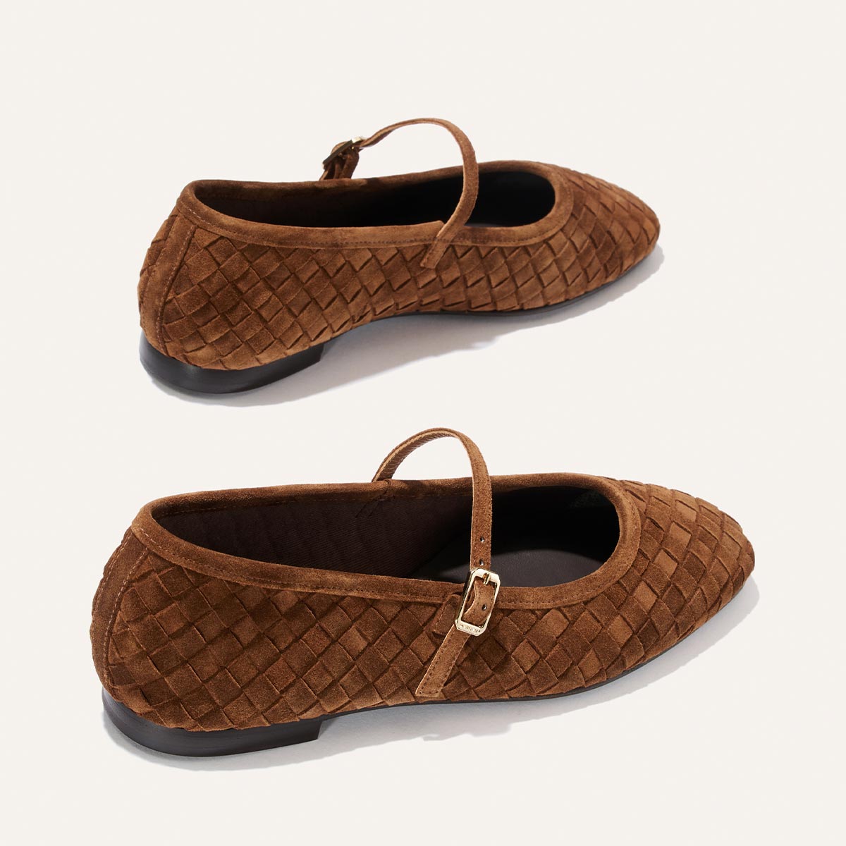 The Margaux "The Fonteyn Jane" flats in Saddle Woven Pasado Suede, featuring a Mary Jane strap with buckle, are displayed from side and top angles on a plain light background.