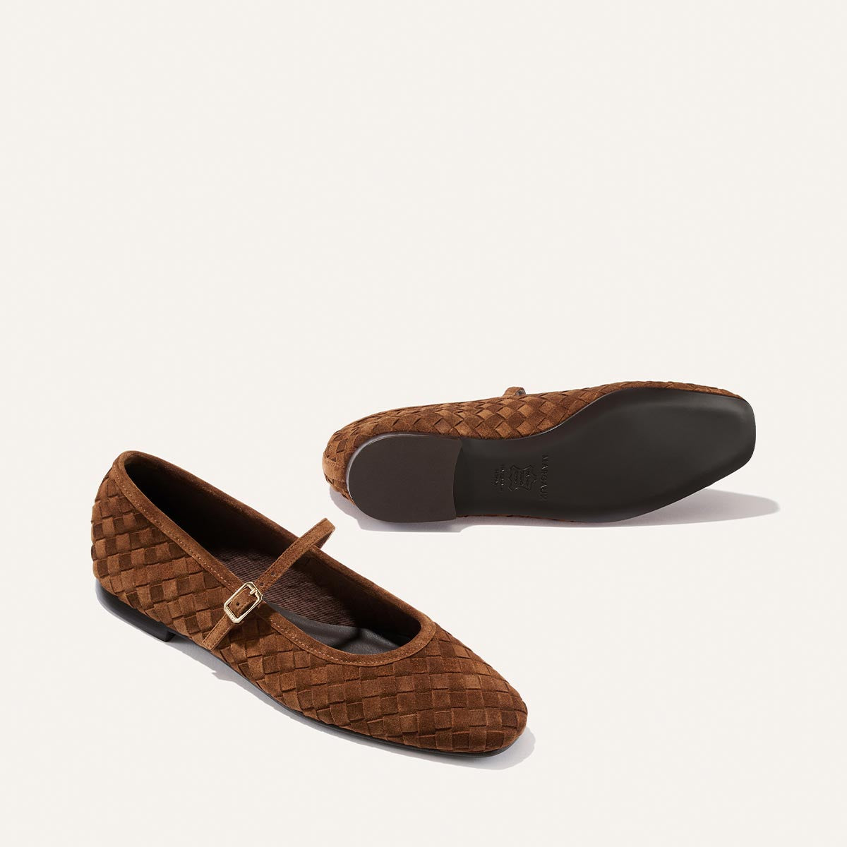 A pair of Margaux "The Fonteyn Jane" flats in Saddle Woven Pasado Suede, featuring buckled Mary Jane straps, displayed from the side and bottom on a plain white background.