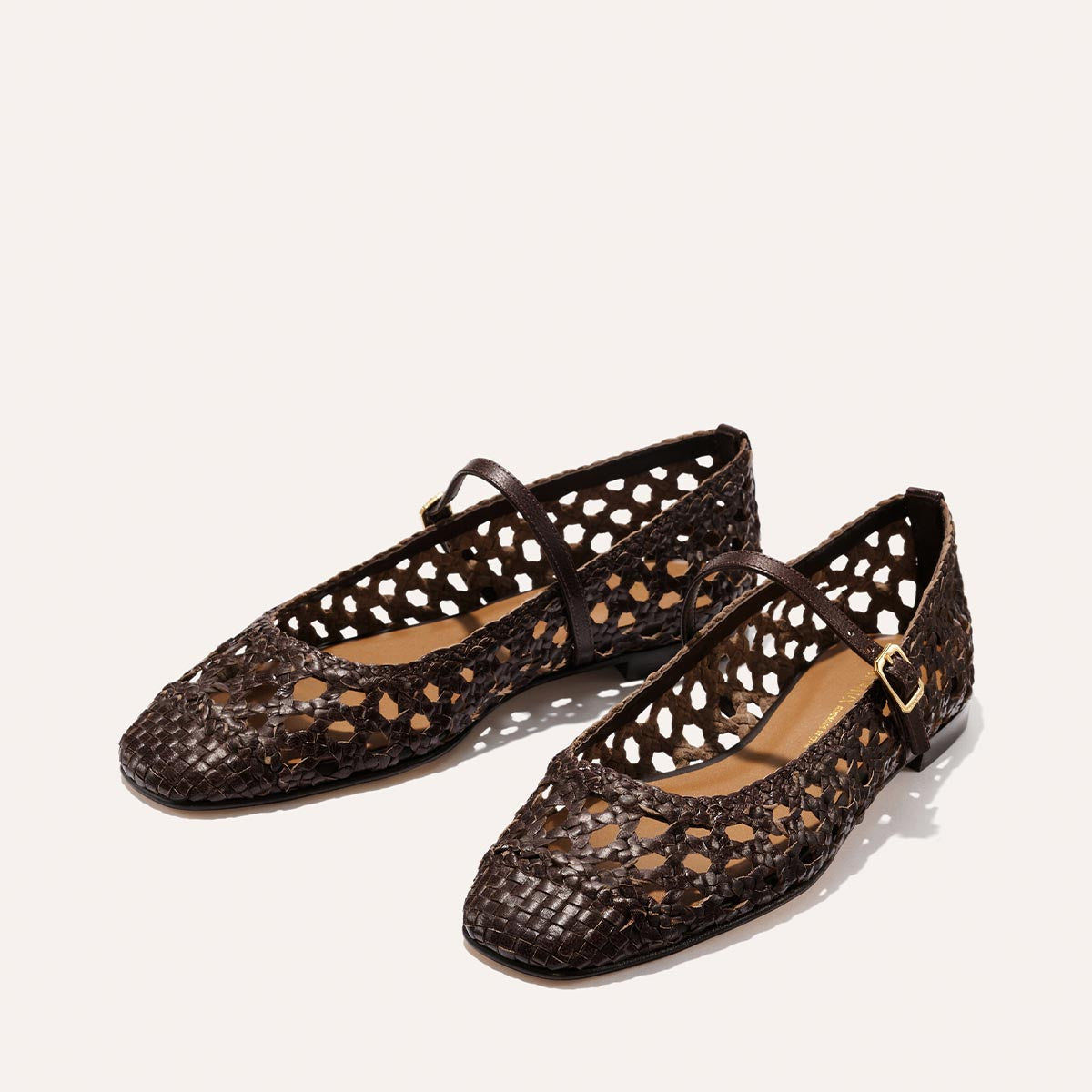 The Fonteyn Jane - Espresso Woven Leather flats by Margaux feature handwoven brown leather, cut-out details, and an adjustable strap, shown on a light background.