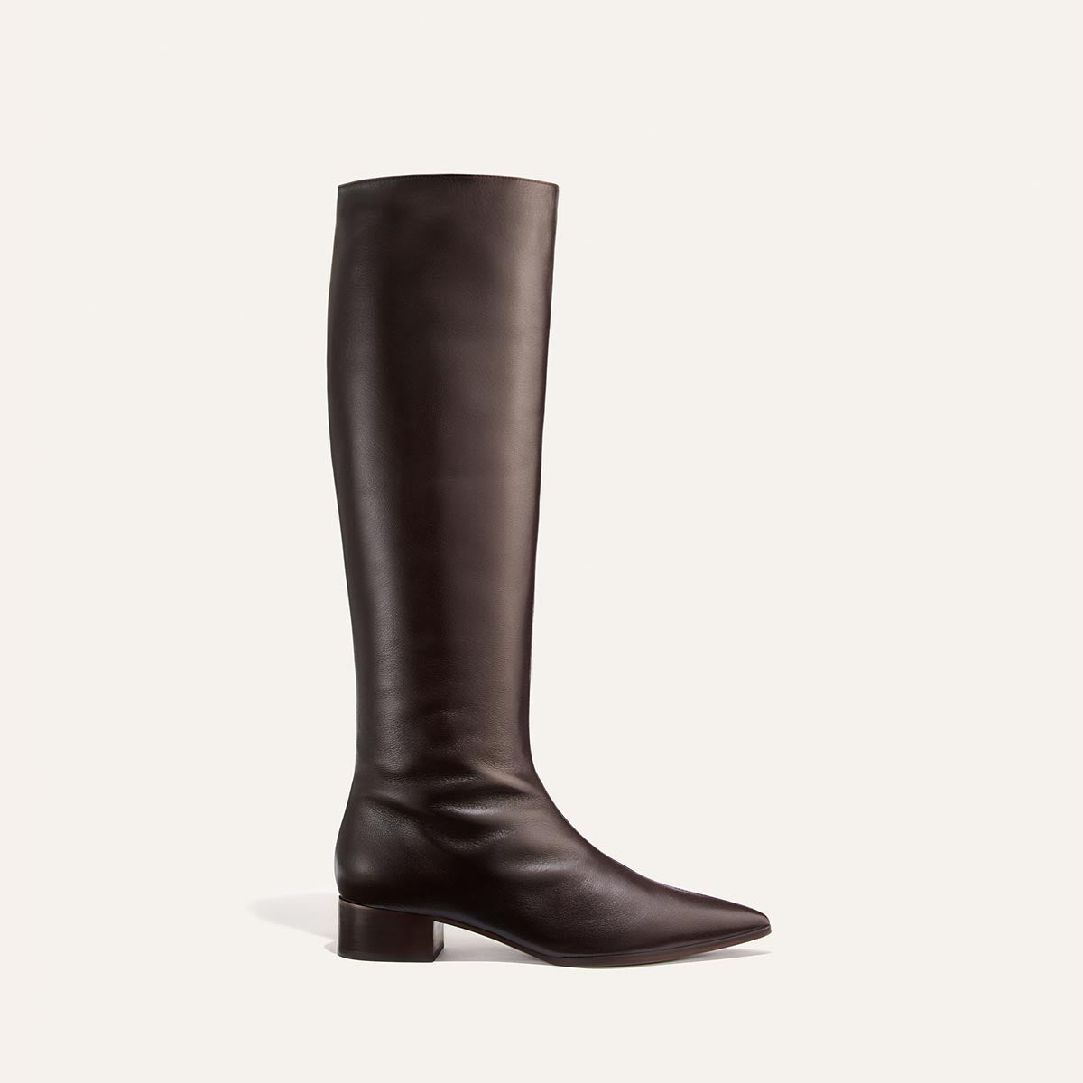 A single dark chocolate calf knee-high boot—the Hayes Knee-High Boot by Margaux—with a low block heel and an almond-shaped toe, featuring a flexible sole for added comfort, is displayed on a plain white background.