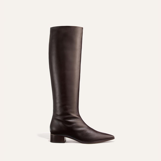 A single dark chocolate calf knee-high boot—the Hayes Knee-High Boot by Margaux—with a low block heel and an almond-shaped toe, featuring a flexible sole for added comfort, is displayed on a plain white background.