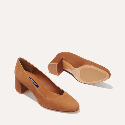 The Heel in Chestnut Suede, a classic block heel featuring a sleek almond toe design complemented by a comfortable 2.5-inch heel.
