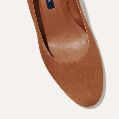 The Heel in Chestnut Suede, a classic block heel featuring a sleek almond toe design complemented by a comfortable 2.5-inch heel.