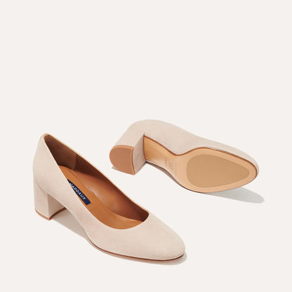 The Heel in Fawn Suede, a classic block heel featuring a sleek almond toe design complemented by a comfortable 2.5-inch heel.
