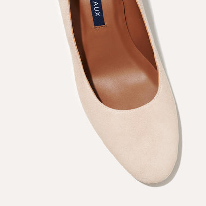 The Heel in Fawn Suede, a classic block heel featuring a sleek almond toe design complemented by a comfortable 2.5-inch heel.