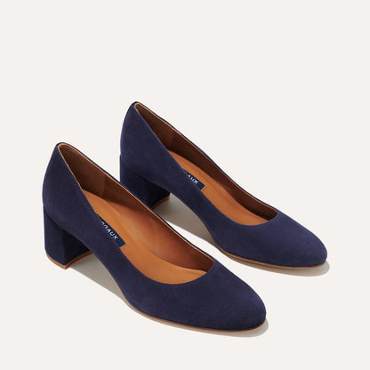 The Heel in Midnight Suede, a classic block heel featuring a sleek almond toe design complemented by a comfortable 2.5-inch heel.