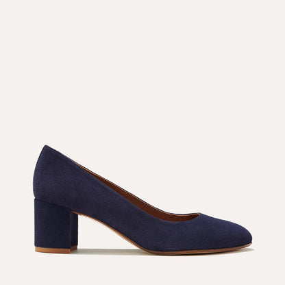 The Heel in Midnight Suede, a classic block heel featuring a sleek almond toe design complemented by a comfortable 2.5-inch heel.