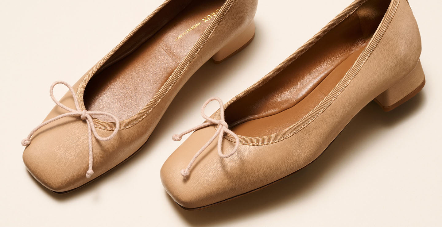 The Ada in Dune Nappa, a comfortable ballet flat with a square toe, adjustable cord bow detail, and comfortable 1-inch block heel.