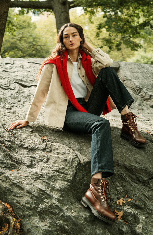 Woman wearing brown hiking boots in a park
