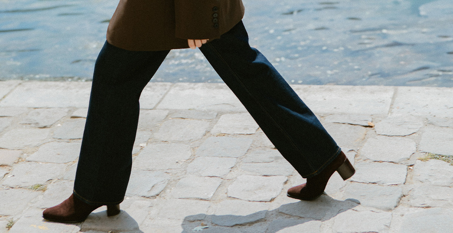 Woman walking in Paris in chocolate suede downtown boots