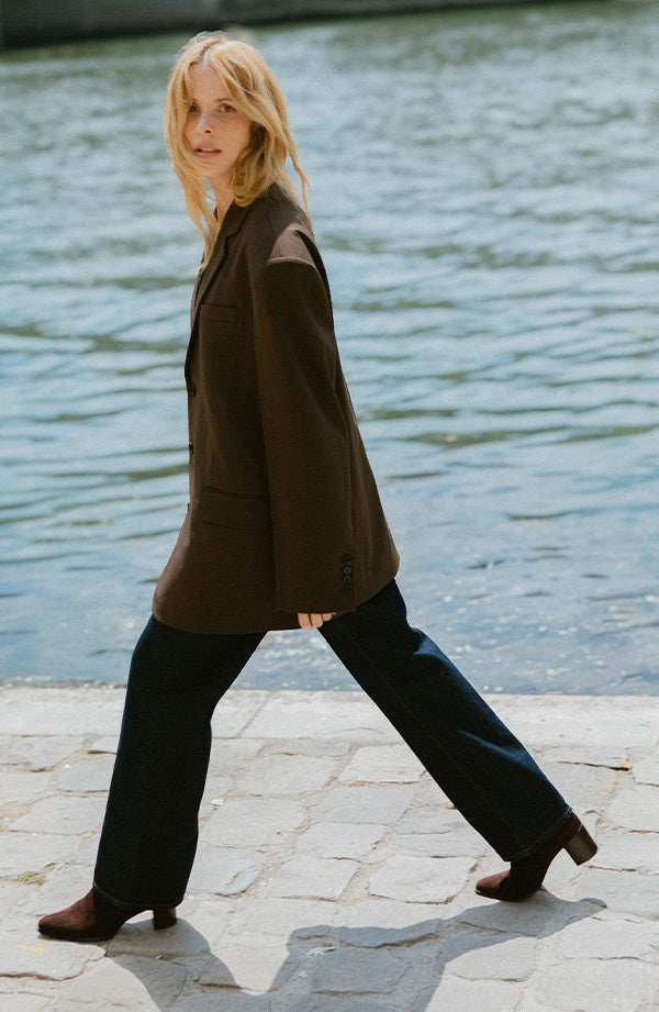 Woman walking in Paris in chocolate suede downtown boots