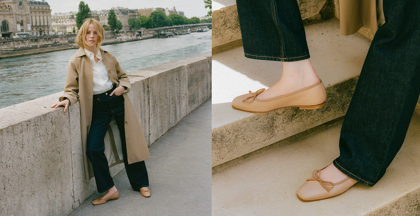 Woman in a beige coat standing by a river with a close-up of her feet wearing flat shoes.