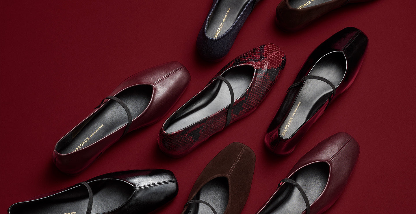 Various women's shoes on a red background