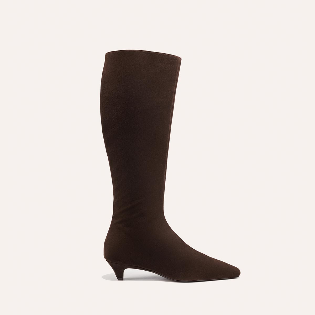 The Imogen - Espresso Suede by Margaux: a single brown suede knee-high boot with a pointed toe and low, slim heel, shown against a plain light background.