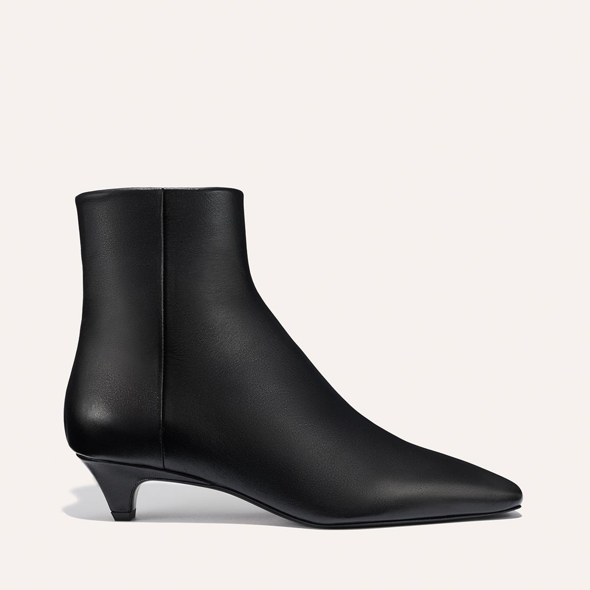The Alex Mill x Margaux: The Inga - Black Calf by margaux-development, a pointed-toe black kitten heel boot inspired by New York City style, is shown in profile against a plain light background.