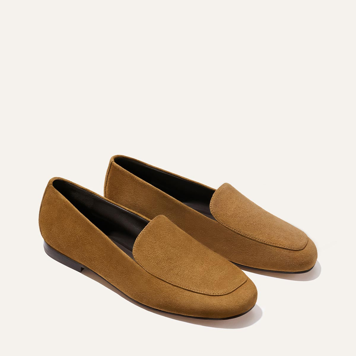 The James Loafer - Cedar Suede by Margaux features a simple, slip-on design and flat soles in brown suede, shown against a light background.