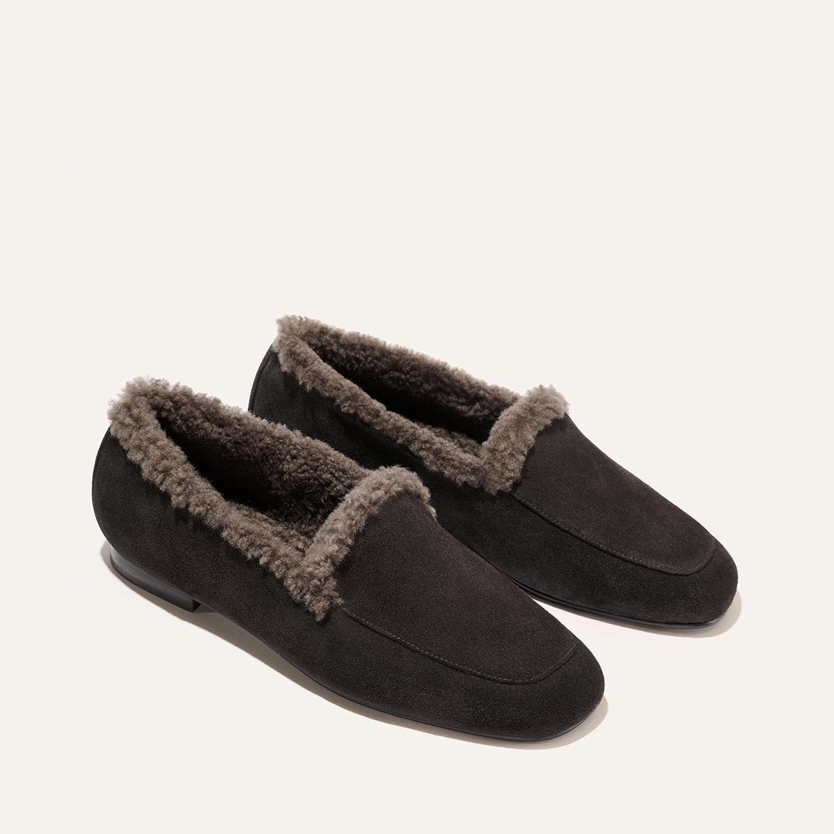 The James Loafer in dark chocolate suede features a grey shearling lining and flexible sacchetto construction.