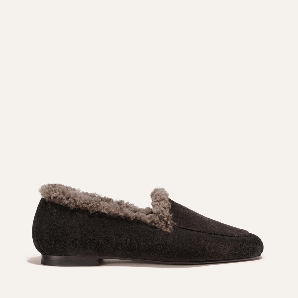 The James Loafer in dark chocolate suede featuring a grey shearling lining and sacchetto construction.