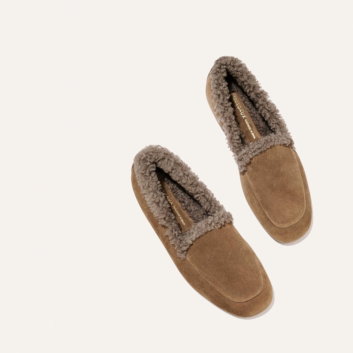 The James Loafer - Driftwood Suede and Shearling: handmade tan suede loafers lined with grey shearling, featuring flexible sacchetto construction.