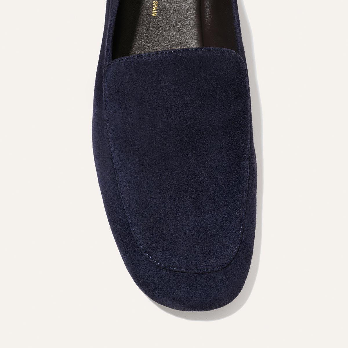 Close-up of Margaux’s The James Loafer in Indigo Suede, highlighting the top and rounded toe against a plain light background.