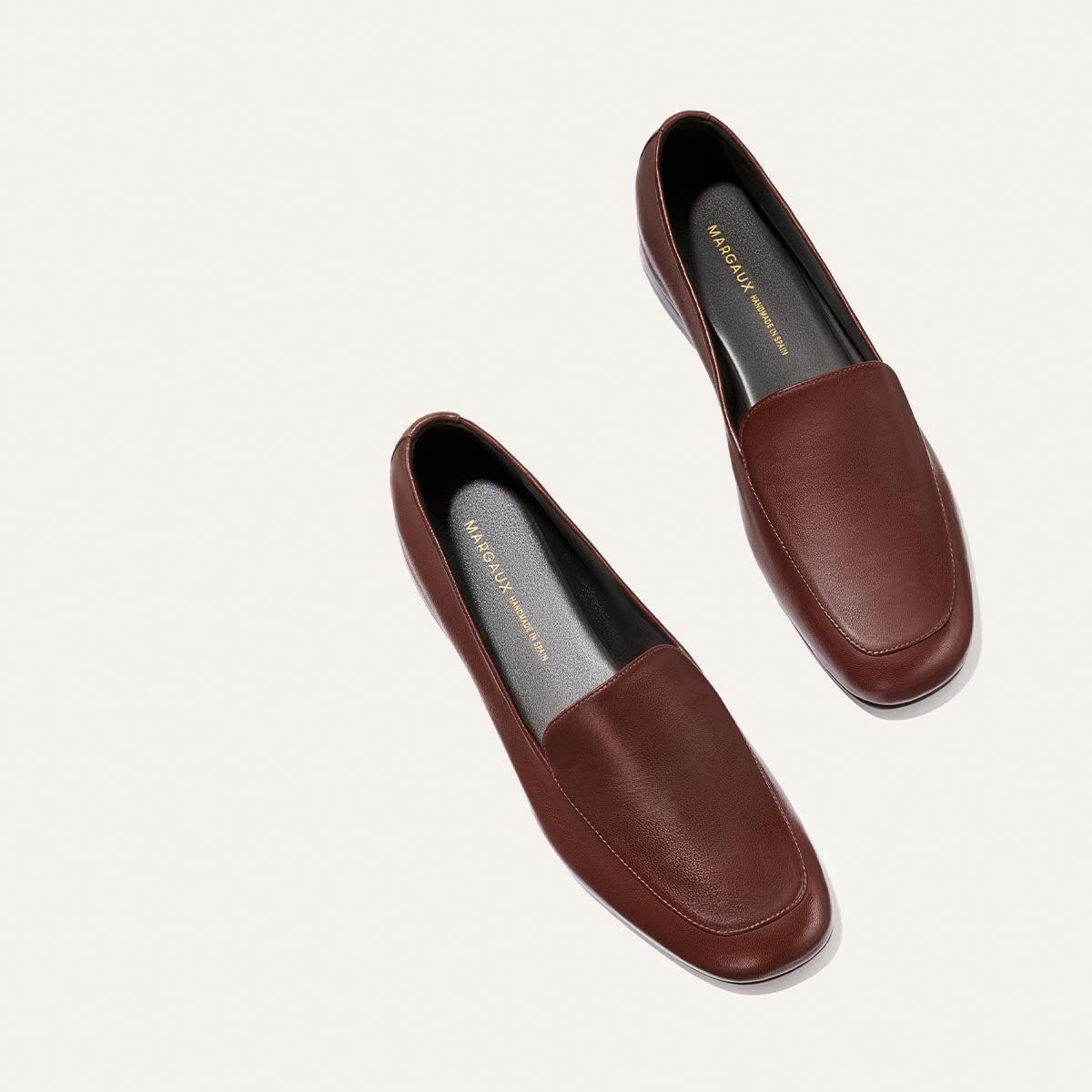 The James Loafer - Mahogany Nappa by Margaux, featuring brown leather construction and black insoles, is photographed from above on a light background and delivers slipper-level comfort.