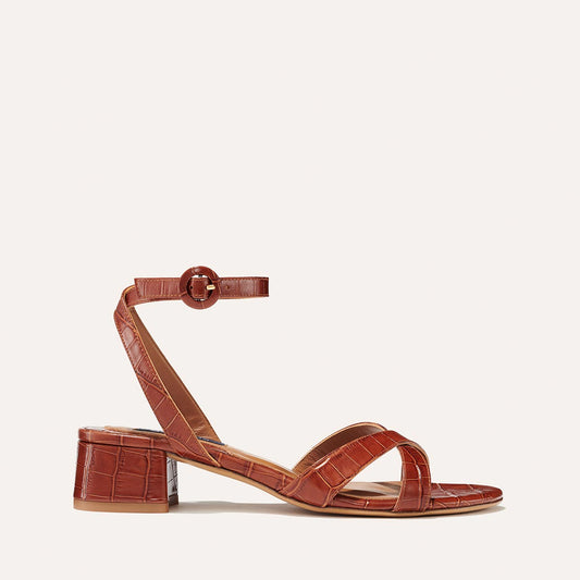 Margaux's classic Lena Sandal in mahogany brown croc-embossed leather with comfortable straps and a lower walkable block heel
