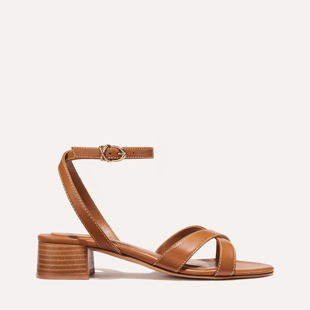 The Lena Sandal in classic Saddle Nappa, featuring perfectly placed straps around the ankle and toes and a comfortable 1.5-inch block heel.