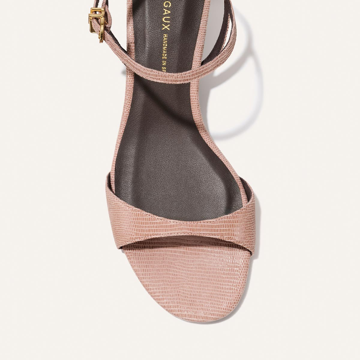 Rose gold sandal with 'MARGAUX' branding on a white background