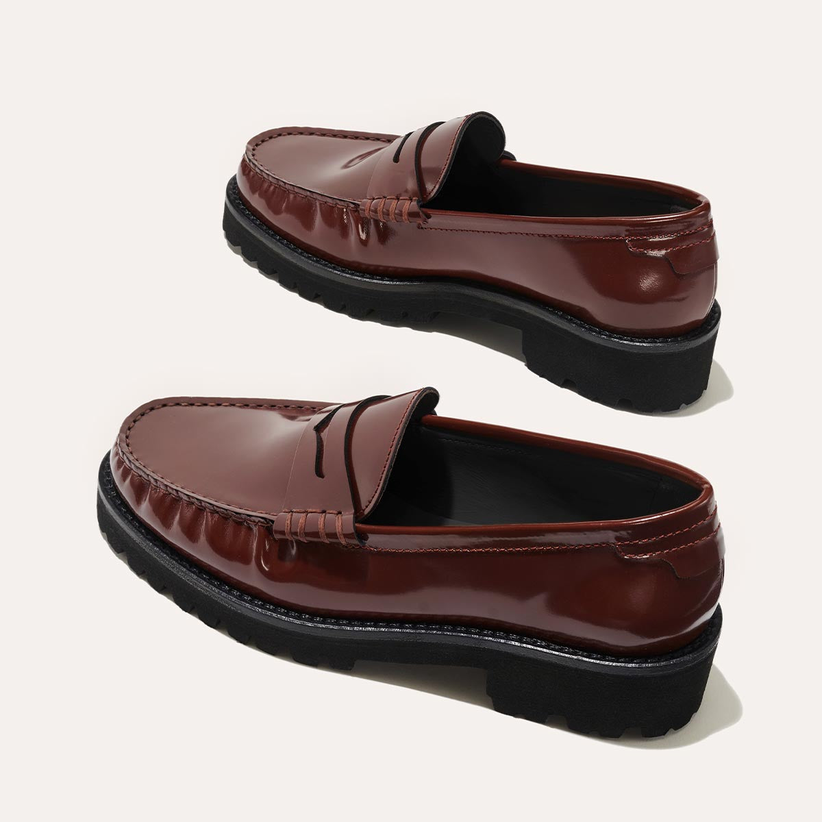 The Louisa Loafer in Hickory Calf, a leather penny loafer with chunky lug sole, featuring high-shine abrasivato leather and a lightweight design.