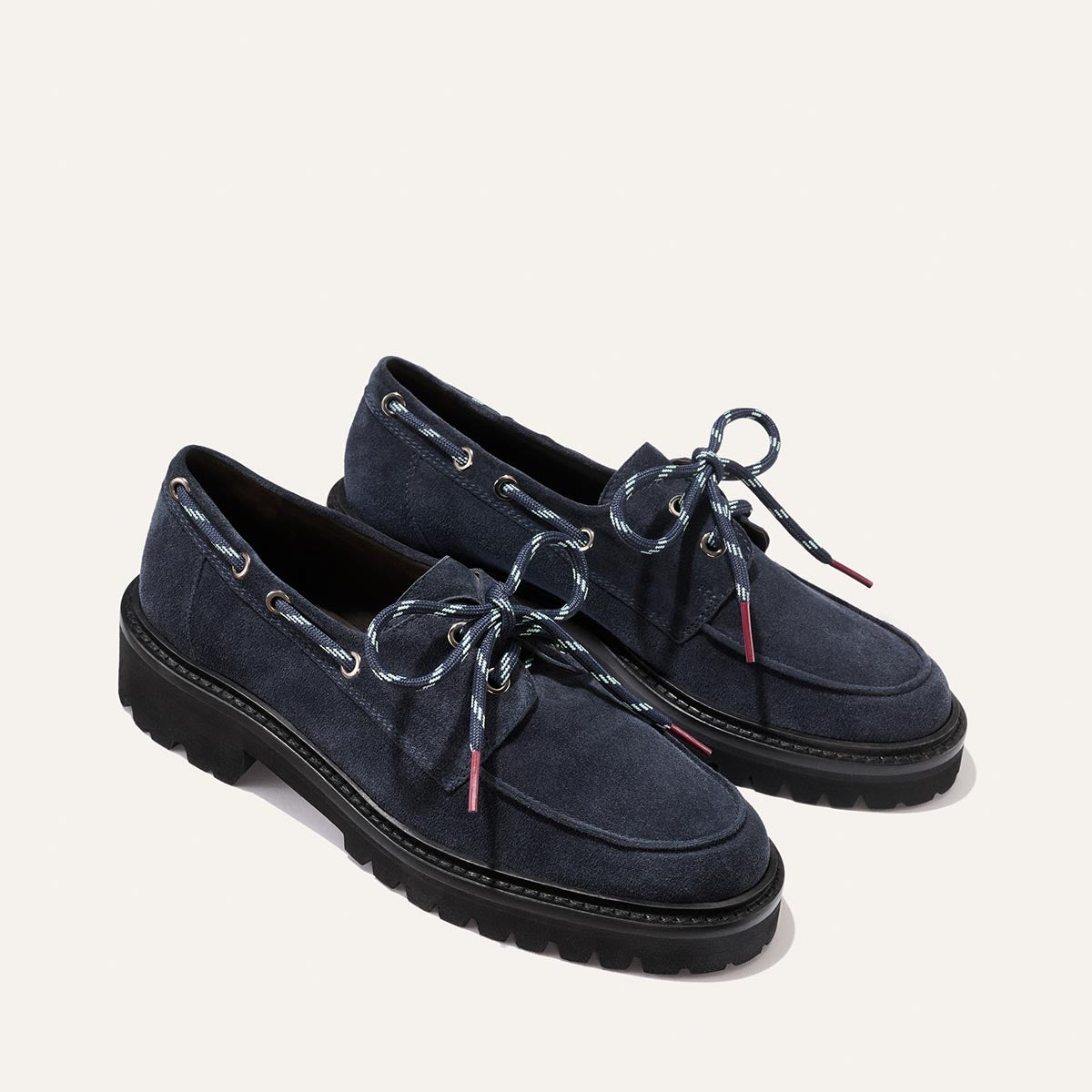 The Marine Loafer - Vintage Navy Suede loafers featuring a lightweight lug sole and blue-and-white patterned laces.