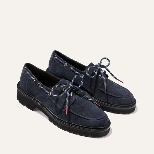 The Marine Loafer - Vintage Navy Suede loafers featuring a lightweight lug sole and blue-and-white patterned laces.