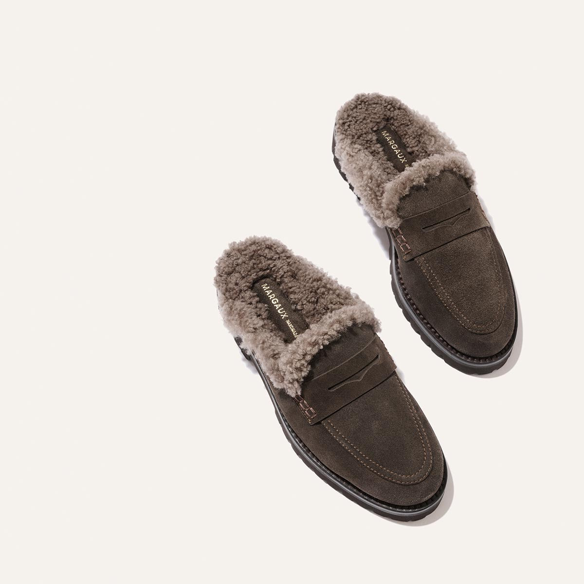 The Marlowe Mule in English brown suede with a cozy shearling lining.