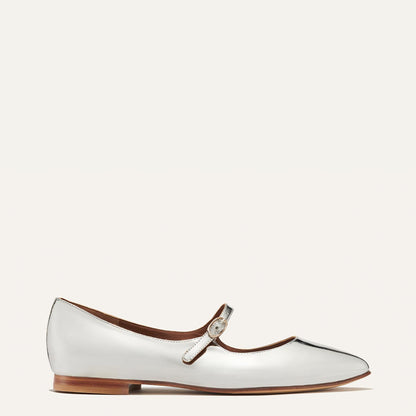 The Mary Jane in shiny Silver Mirror Patent, a ballet flat with a pointed toe and an adjustable strap for a secure fit.