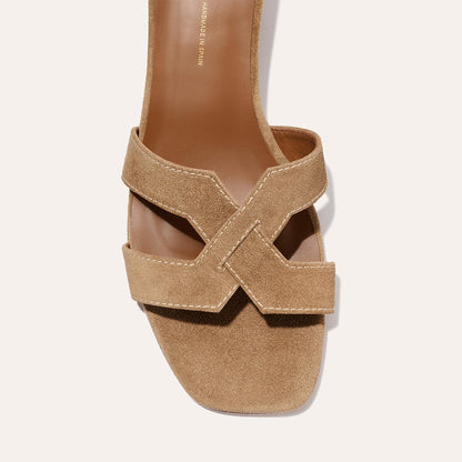 The MX 35 - Biscotti Suede by Margaux is a tan suede sandal featuring a square toe and wide crisscross straps, viewed from above against a light background.