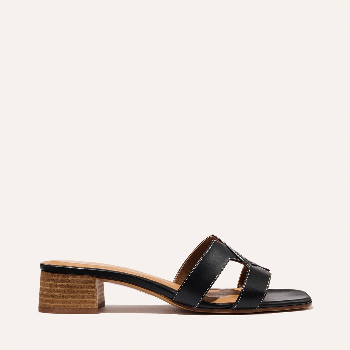 The MX 35 - Black Calf by Margaux-development is a black open-toe sandal with two cut-out straps and a low block heel, shown on a plain light background.