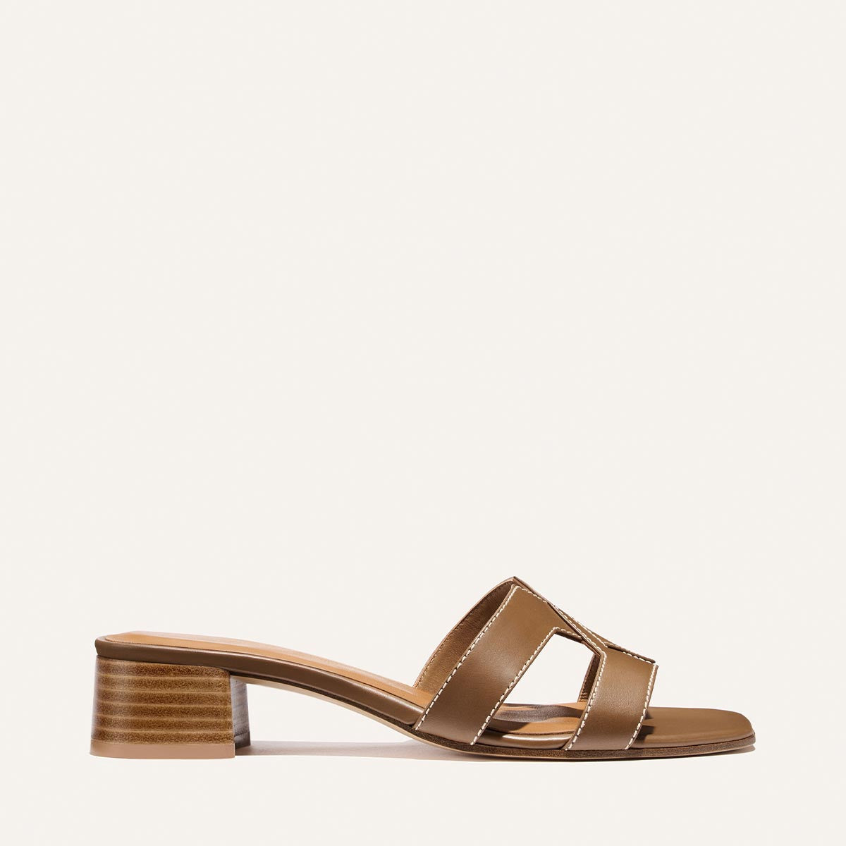 The MX 35 - Mocha Calf by Margaux showcases mocha calf leather with a low block heel and two wide cutout straps, presented on a plain white background.