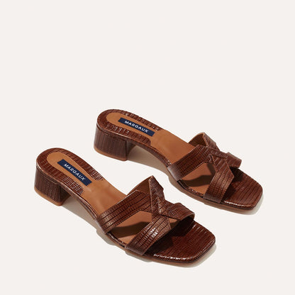 The MX 35 in Brown Lizard, a slip-on sandal with structured straps, a subtly square toe and a comfortable 1.5-inch block heel.