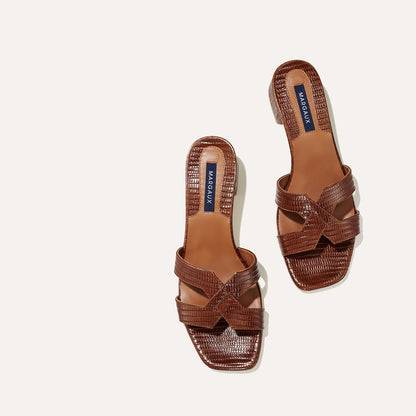The MX 35 in Brown Lizard, a slip-on sandal with structured straps, a subtly square toe and a comfortable 1.5-inch block heel.