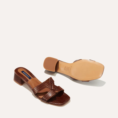 The MX 35 in Brown Lizard, a slip-on sandal with structured straps, a subtly square toe and a comfortable 1.5-inch block heel.