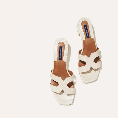 The MX 35 in Ecru Lizard, a slip-on sandal with structured straps, a subtly square toe and a comfortable 1.5-inch block heel.