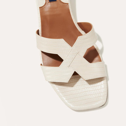 The MX 35 in Ecru Lizard, a slip-on sandal with structured straps, a subtly square toe and a comfortable 1.5-inch block heel.