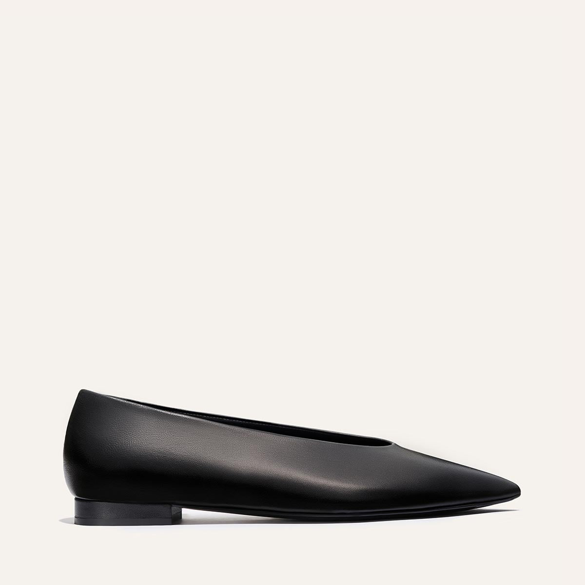 The Parra - Black Nappa by margaux-development: a black leather flat with a pointed toe and low heel, shown in side profile against a plain off-white background.