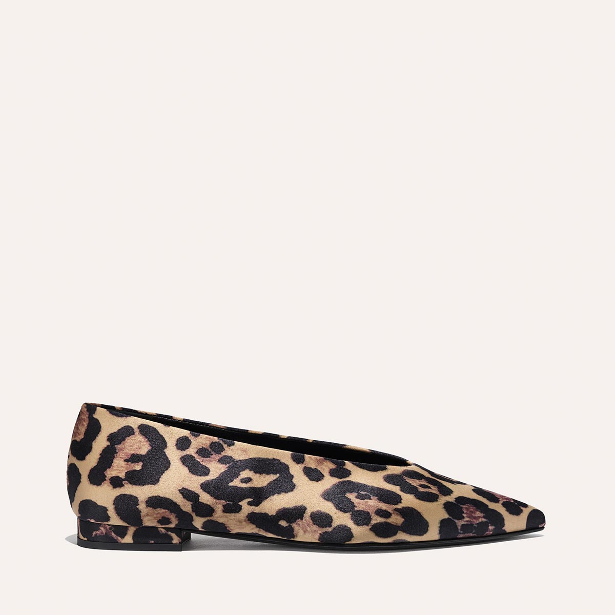 The Parra - Leopard Satin by margaux-development is a pointed-toe flat shoe featuring a bold leopard print in brown, tan, and black tones, displayed against a plain light background.