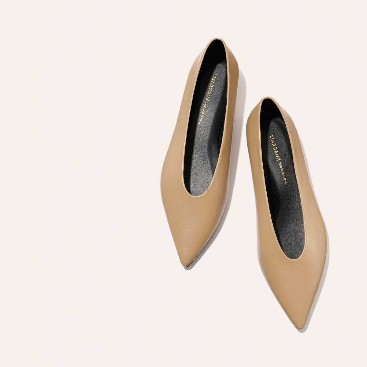 The Parra - Praline Nappa by margaux-development are tan shoes with a structured silhouette and high vamp.