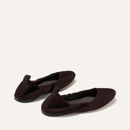The Pascale - Espresso Suede by Margaux: a pair of brown suede ballet flats with elasticized backs and pull tabs, shown on a plain light background.