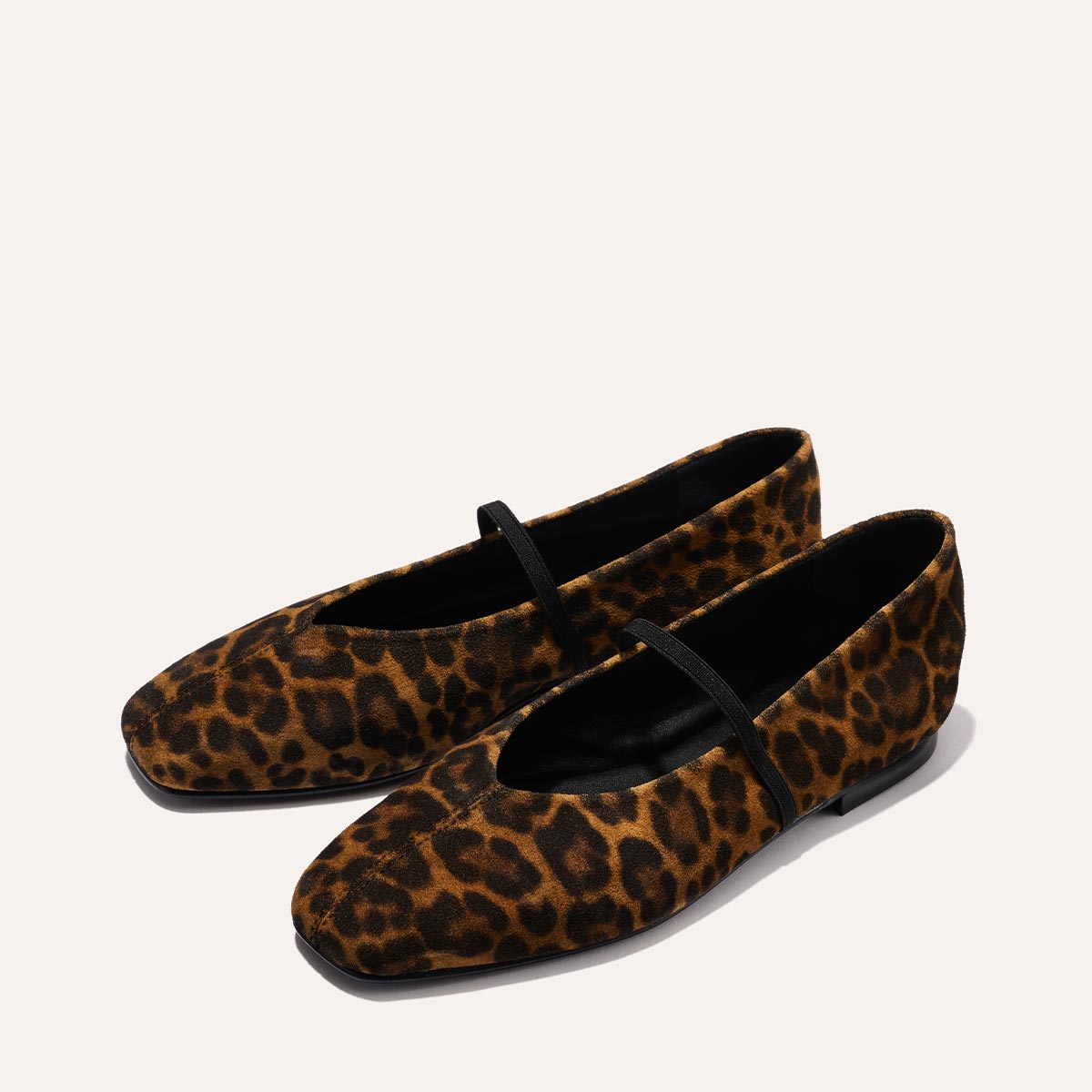 The Phoebe in luxe Leopard Suede, a ballet flat with a squared off toe, high vamp and elastic Mary Jane strap.